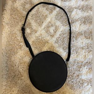 Anthropologie black faux leather round cross body with handle